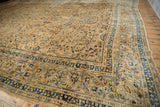 Distressed vintage Meshed carpet with lustrous sand field, indigo blue floral border detail.