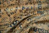 Distressed wool pile of the Persian Meshed carpet, revealing sand, indigo blue palmettes.