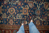 Vintage Mahal carpet detail: sapphire blue field, blossomed arabesques, and red multi-banded border.