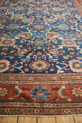 Persian Mahal carpet border showcasing intricate madder root red and blue floral motifs.