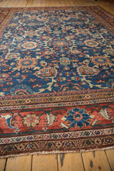 Rich madder root red border of vintage Mahal carpet with detailed blue floral motifs and fringe.