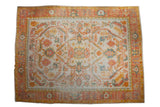 Vintage Oushak carpet with large palmette and scrolling leaves, blush, saffron, dusty teal, ivory field.