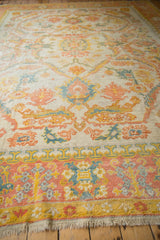 Hand-knotted Vintage Oushak carpet: rose, saffron, dusty teal palmette border and fringe.