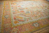 Hand knotted Turkish Oushak carpet corner, blush, saffron, and dusty teal border design.