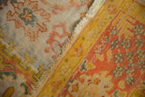 Hand knotted Vintage Oushak with blush, saffron, teal palmette pile and woven foundation.