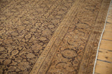 Vintage distressed Sivas carpet detail: brown Herati field and Turtle Samovar border texture.