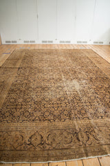 Vintage distressed Sivas carpet's Turtle Samovar border and Herati pattern in aubergine and beige.