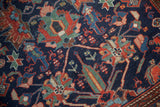 Textured hand-knotted pile of a vintage Malayer rug showing gem-tone floral and animal designs.