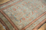 Distressed Malayer runner showing faded teal and pale red Herati motif with vine borders.
