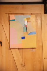 Sarah Martinez original abstract painting hanging on a light wood barn door.
