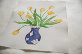 Angled view of the Sarah Martinez tulip painting on handmade paper with a deckled edge.