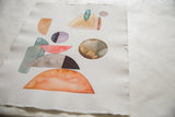 Abstract watercolor shapes, rough texture, and deckled edge on handmade paper.