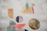 Abstract watercolor painting detail featuring teal, purple, brown shapes on handmade deckled paper.
