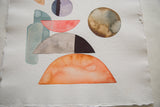 Texture of deckled edged handmade paper with abstract brown and grey watercolor circle.