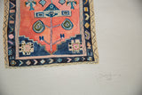 Corner of Sarah Martinez rug painting: geometric border, coral field, artist signature, 2017.