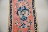 Close-up of Sarah Martinez painting, showing coral, blue abstract pattern on textured paper.