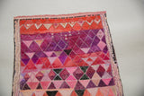Close-up of Sarah Martinez watercolor painting, showing vibrant red and purple geometric patterns.
