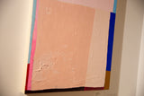 Angled view of the abstract painting's textured acrylic surface and deep wood panel.
