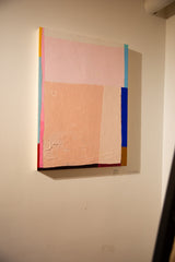 Colorblock No. 24 abstract painting on a wall, with shadows revealing its thick wood panel.