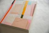Sarah Martinez Colorblock art: textured surface detail with peach, pink, yellow, and blue.