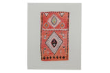 Sarah Martinez limited edition print of a vintage rug with geometric coral, black, and pink patterns.