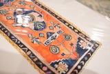 Textured watercolor of the Sarah Martinez rug print with blue patterns and signature.