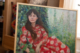 Textured brushstrokes capture a girl in a red dress, framed in light wood.