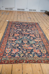 Vintage Hamadan rug with traditional allover blossom design in navy and warm rust.