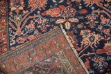 Hand-knotted Hamadan rug detail: intricate reverse and navy pile with blossom and palmette motifs.