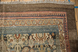 Worn pile on a distressed Bibikabad carpet corner, showing geometric borders and subtle palmette motifs.