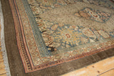 Textured brown selvage and madder root red border on a distressed vintage Bibikabad carpet.