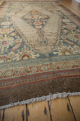 Distressed Bibikabad carpet: worn end fringe, chocolate brown selvage, and colorful borders.