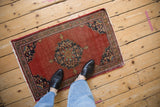 Traditional Vintage Farahan Sarouk rug mat, brick red field, scalloped spandrels, tattered ends.
