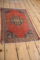 Vintage Farahan Sarouk mat corner, dark navy scalloped spandrel, multi-color floral border.