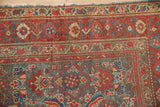 Antique Malayer rug showing faded Herati motif, visible wear in red, slate blue, and gold.