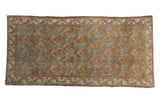 Faded coffee brown and sky blue floral lattice on a distressed Bibikabad runner.