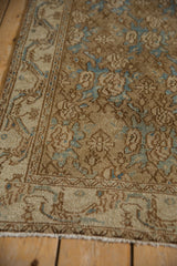 Distressed Persian Bibikabad runner border with faded pale coffee brown and sky blue vine motifs.