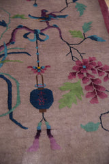 Pictorial Art Deco design detail with a cobalt blue lantern, perched bird, and scrolling branches.