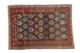 Vintage Caucasian rug featuring large scale floral palmettes and serpents on navy, 4x6.