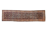 Vintage Mahal rug runner with a charcoal Herati design field and lighter ivory borders with floral vines.