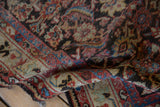 A fold in the vintage Persian Mahal runner revealing its detailed weave and knot heads.