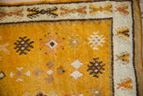 Simplistic geometric guls in saffron field, ivory border of vintage Moroccan rug.