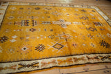 Saffron yellow and brown geometric floral guls and border on a vintage Moroccan rug.