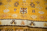 Vintage Moroccan rug with saffron yellow field, ivory border, geometric guls, and thick pile.