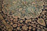 Worn pile of a vintage Malayer rug, with navy, oxidized copper green, and pale blush floral motifs.