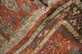 Original macrame fringe, rectilinear borders with wave motif on this antique Soumac carpet.