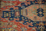 Antique Soumac carpet detail: sapphire blue, brick red, arrowed plants, and woven animal motifs.