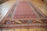 Antique Kurdish runner corner, chocolate brown serrated leaf border, cherry red trellis field.