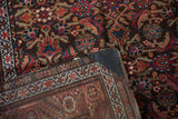 Antique Northwest Persian rug's folded corner showing Herati pattern, hand-knotted reverse, and reinforced end.
