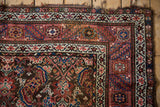 Fine antique Northwest Persian rug corner displaying intricate borders and Herati field patterns.